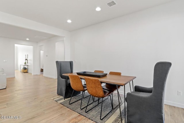 dining space featuring light wood-type flooring