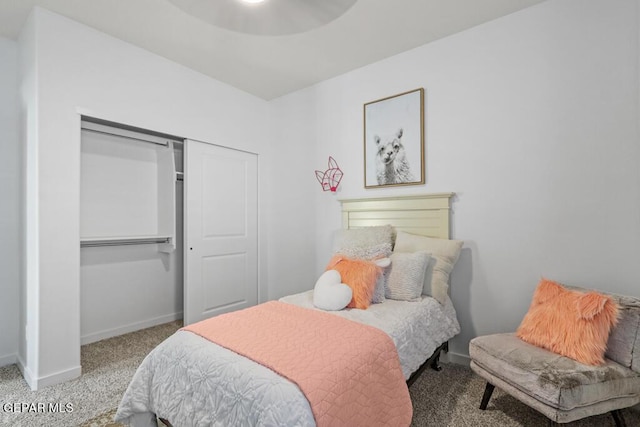 bedroom with carpet flooring and a closet