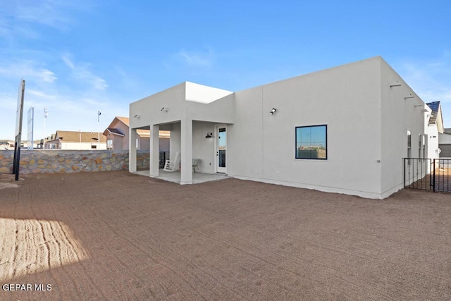 rear view of house featuring a patio area