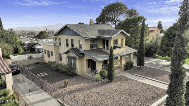 view of front of home with a mountain view and a porch