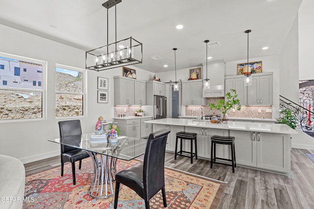 dining room featuring dark hardwood / wood-style flooring and sink