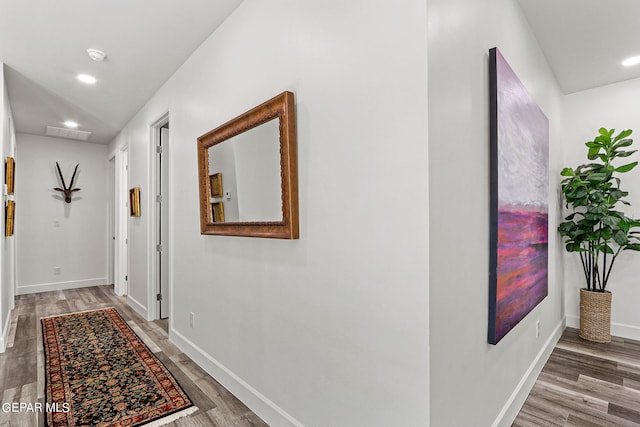 hallway featuring wood-type flooring