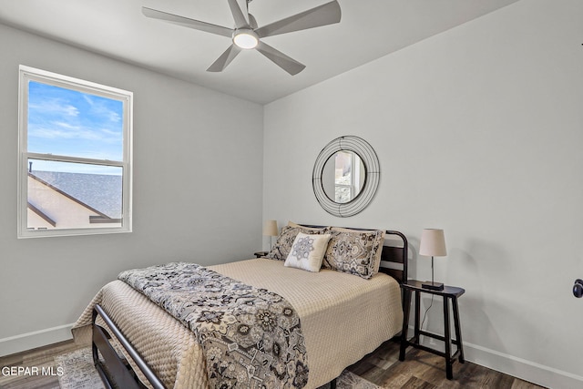 bedroom with ceiling fan and dark wood-type flooring