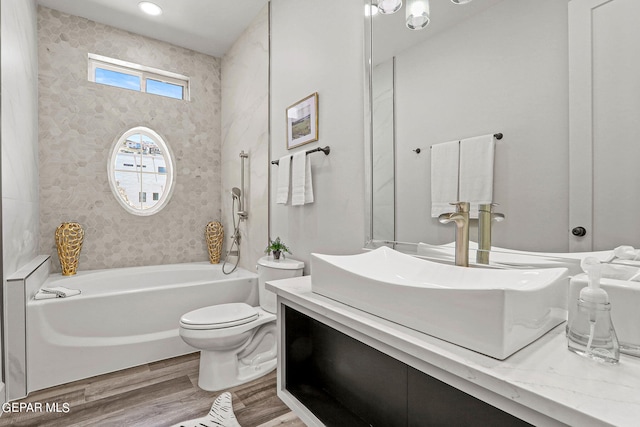 full bathroom featuring shower / bath combination, vanity, toilet, and wood-type flooring