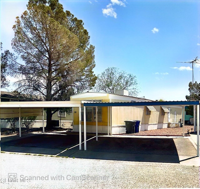 view of parking / parking lot with a carport