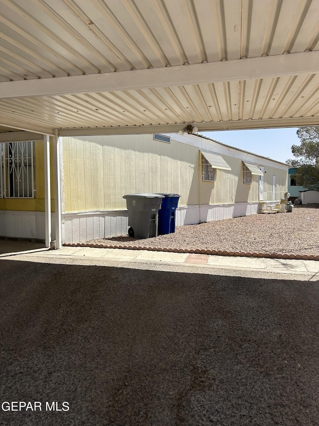 exterior space with a carport