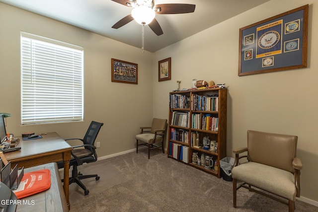 carpeted home office with ceiling fan