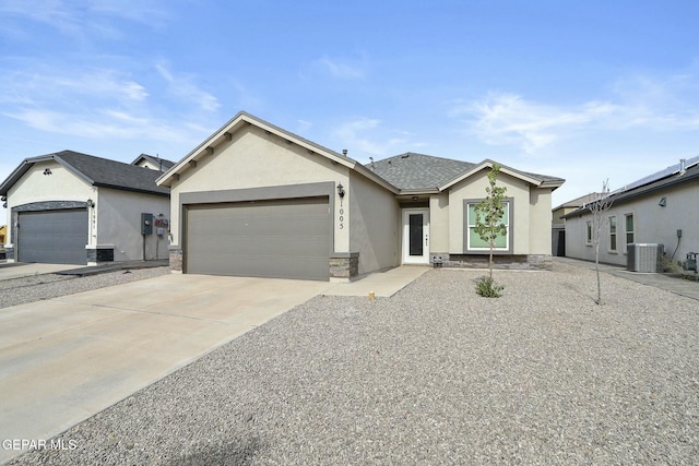 ranch-style house with a garage and cooling unit