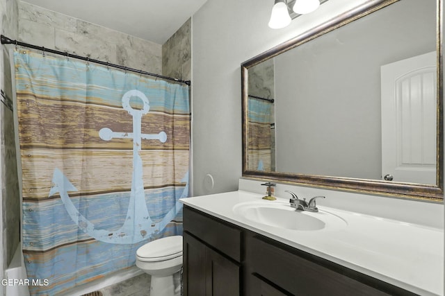 bathroom with tile patterned floors, vanity, and toilet