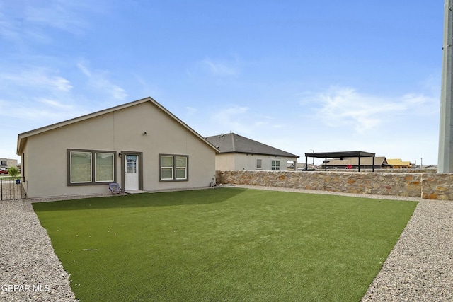 rear view of house with a lawn