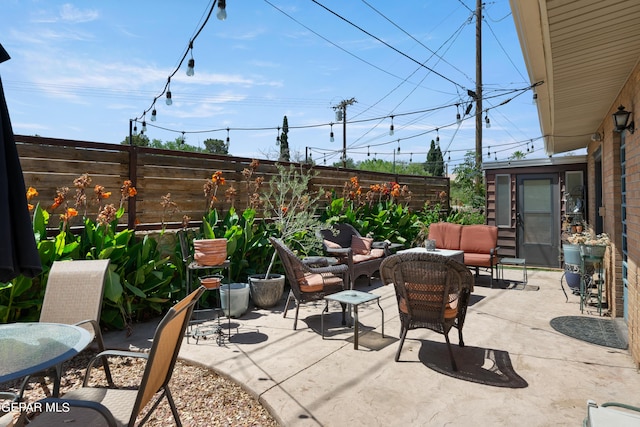 view of patio with a fenced backyard and an outdoor hangout area