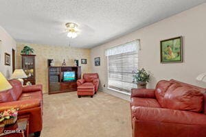 living room featuring carpet floors and ceiling fan