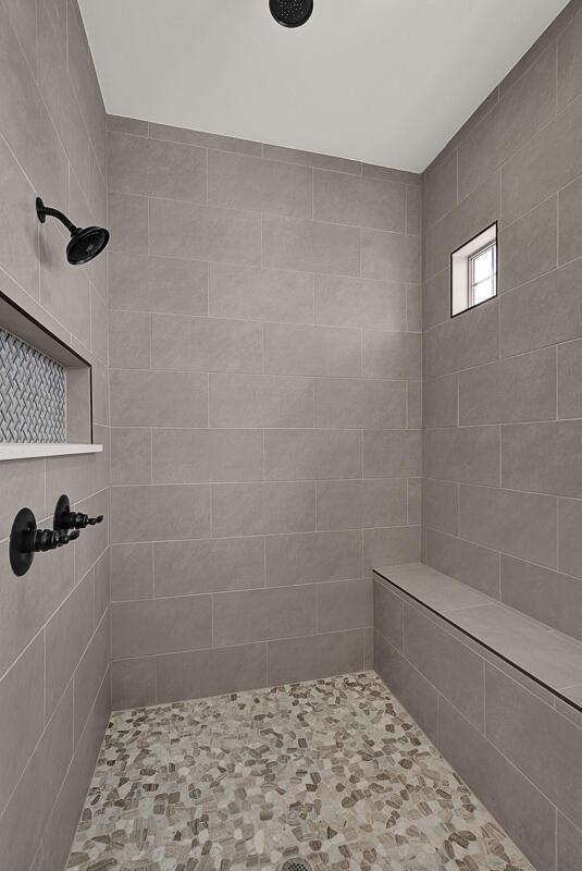 bathroom with tiled shower