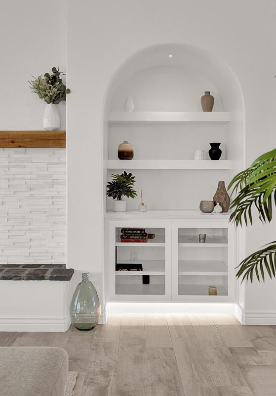 bar featuring built in shelves and light hardwood / wood-style flooring