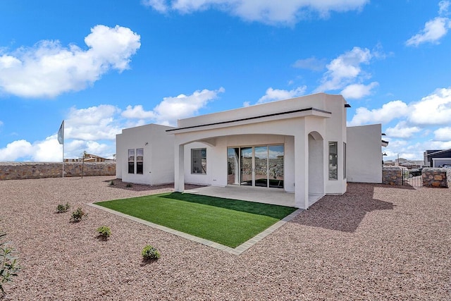 rear view of property featuring a patio