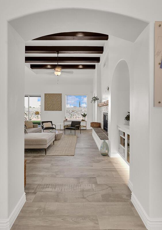 hallway featuring beam ceiling