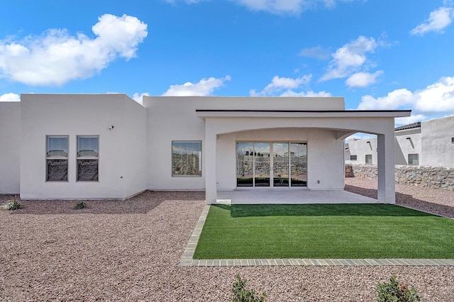 rear view of house with a patio area