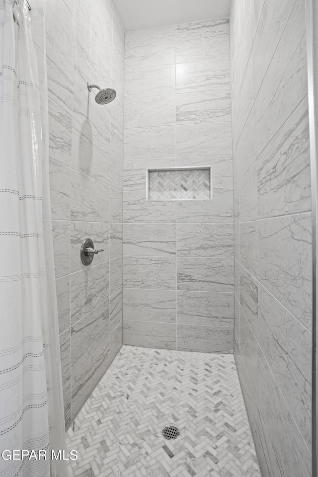 bathroom with curtained shower