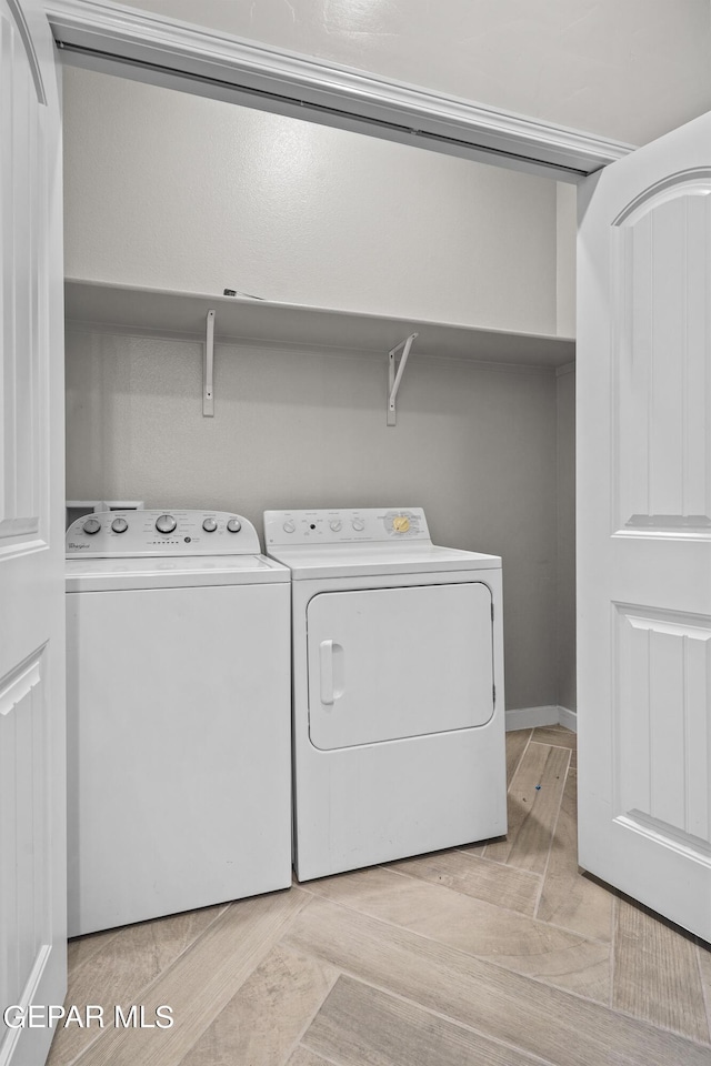 laundry room featuring independent washer and dryer