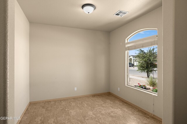 empty room with light tile flooring