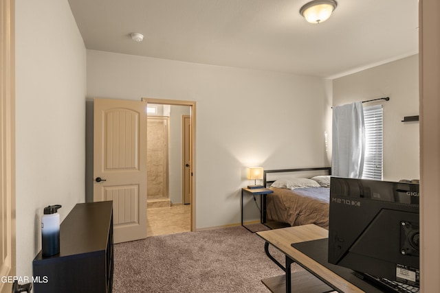 bedroom featuring carpet and baseboards