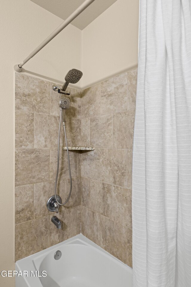 bathroom featuring shower / bath combination with curtain