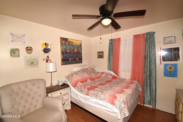 bedroom featuring dark hardwood / wood-style floors and ceiling fan