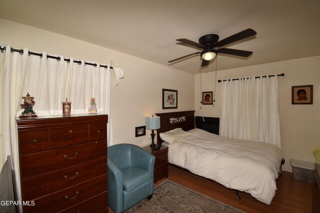 bedroom featuring hardwood / wood-style flooring and ceiling fan