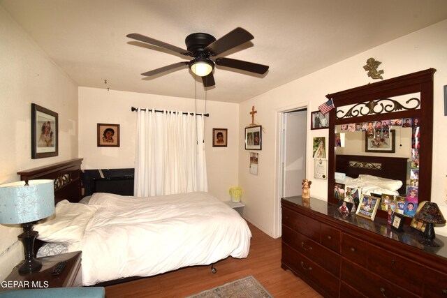 bedroom featuring hardwood / wood-style flooring and ceiling fan