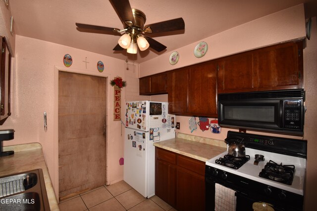 kitchen featuring white appliances, light tile flooring, and ceiling fan