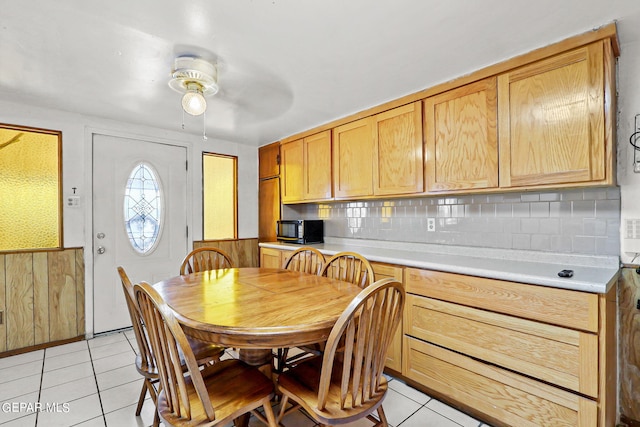 dining area with ceiling fan and light tile patterned floors