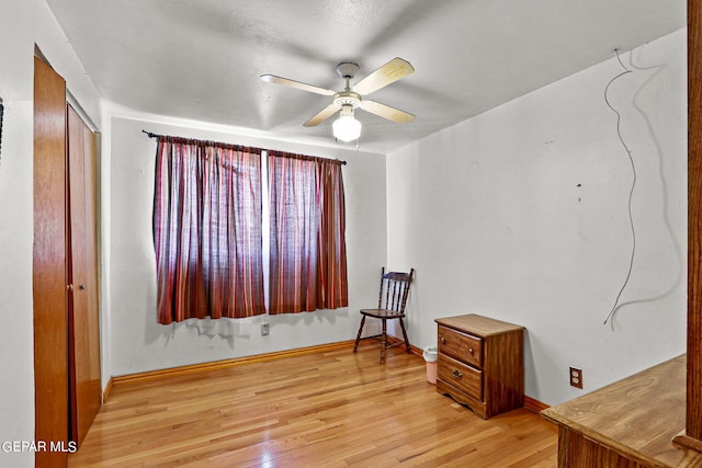 interior space featuring light wood-type flooring and ceiling fan