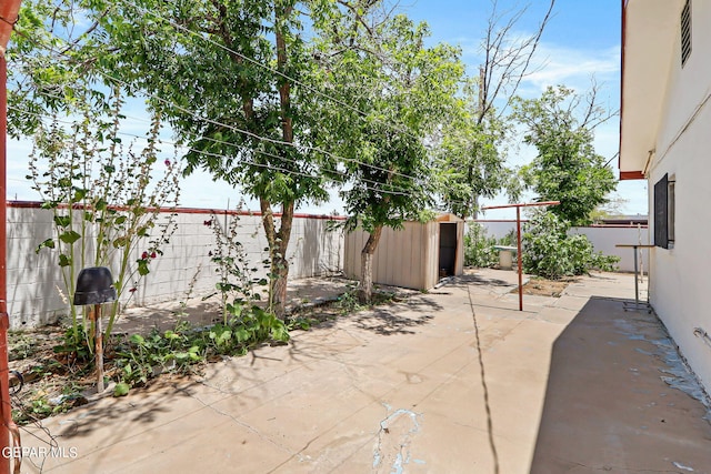 view of patio featuring a storage shed