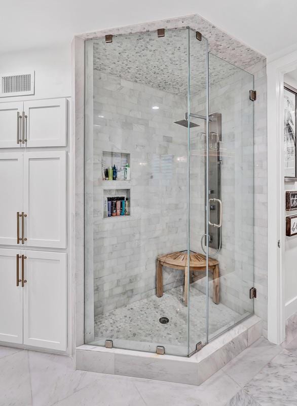 928 Singing Hills Dr, El Paso, TX 79912 - full bathroom with a shower stall, marble finish floor, and visible vents