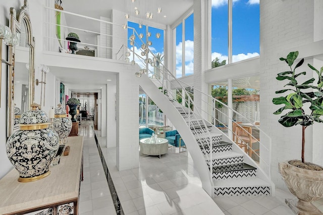 928 Singing Hills Dr, El Paso, TX 79912 - entrance foyer with tile patterned floors and a towering ceiling