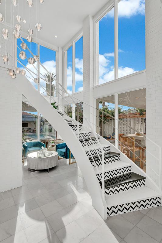 928 Singing Hills Dr, El Paso, TX 79912 - staircase with tile patterned floors and a high ceiling