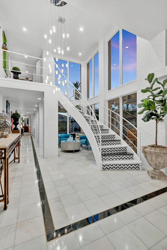 928 Singing Hills Dr, El Paso, TX 79912 - staircase featuring a high ceiling and tile patterned floors