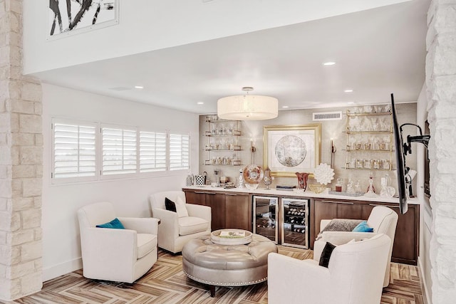 928 Singing Hills Dr, El Paso, TX 79912 - living area featuring recessed lighting, beverage cooler, visible vents, and bar