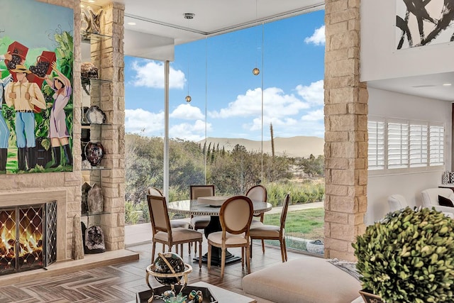928 Singing Hills Dr, El Paso, TX 79912 - interior space with an outdoor stone fireplace, a mountain view, and a wall of windows