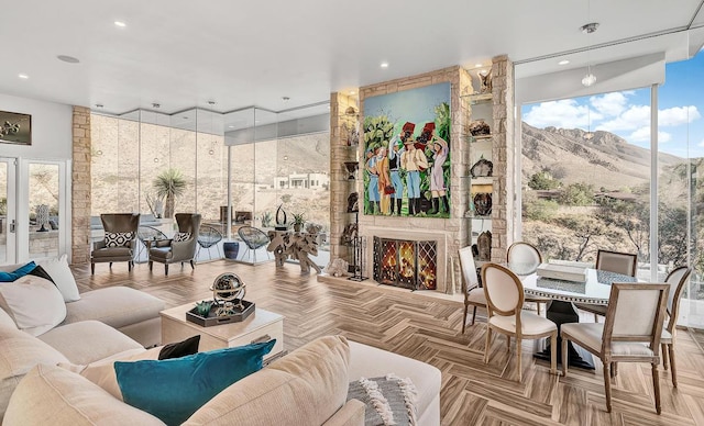 928 Singing Hills Dr, El Paso, TX 79912 - living area featuring recessed lighting, a large fireplace, a mountain view, and a wall of windows