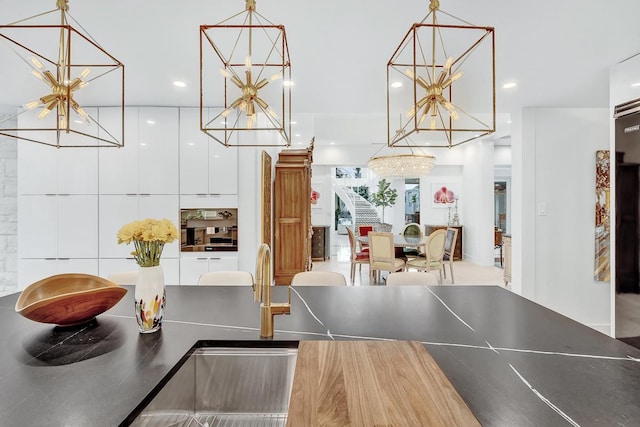928 Singing Hills Dr, El Paso, TX 79912 - interior space with recessed lighting and an inviting chandelier