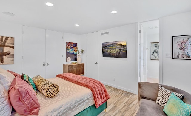 928 Singing Hills Dr, El Paso, TX 79912 - bedroom with a closet, light wood-type flooring, ensuite bath, visible vents, and recessed lighting