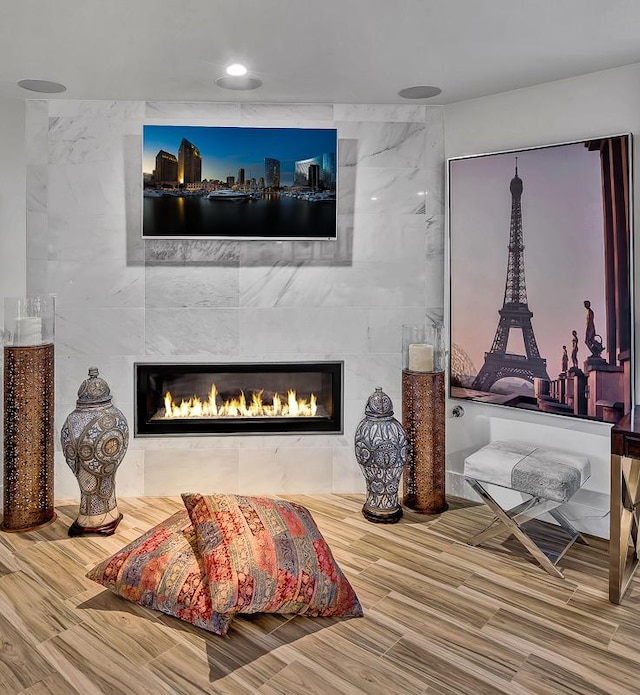 928 Singing Hills Dr, El Paso, TX 79912 - living area featuring a tile fireplace, wood finished floors, and recessed lighting