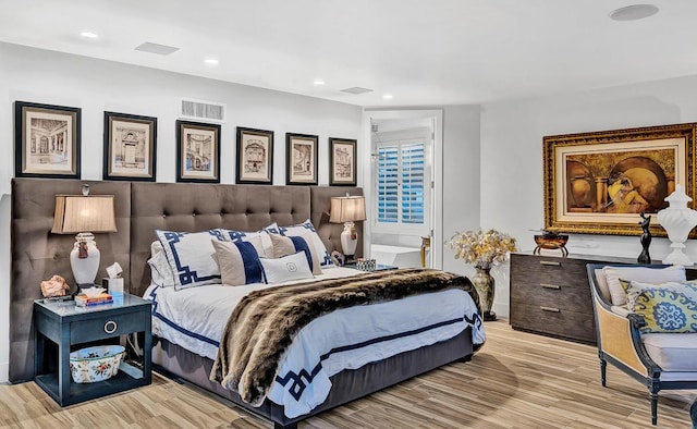 928 Singing Hills Dr, El Paso, TX 79912 - bedroom with wood finished floors, visible vents, and recessed lighting