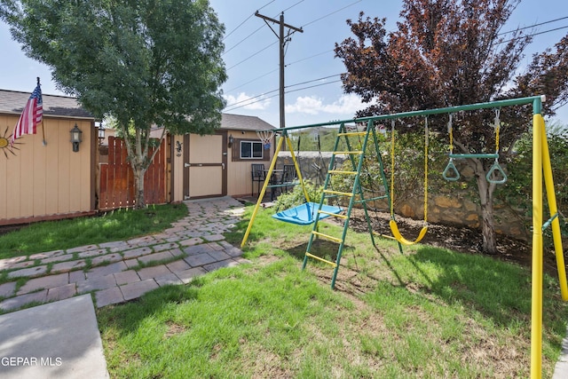 view of yard with a playground and a shed