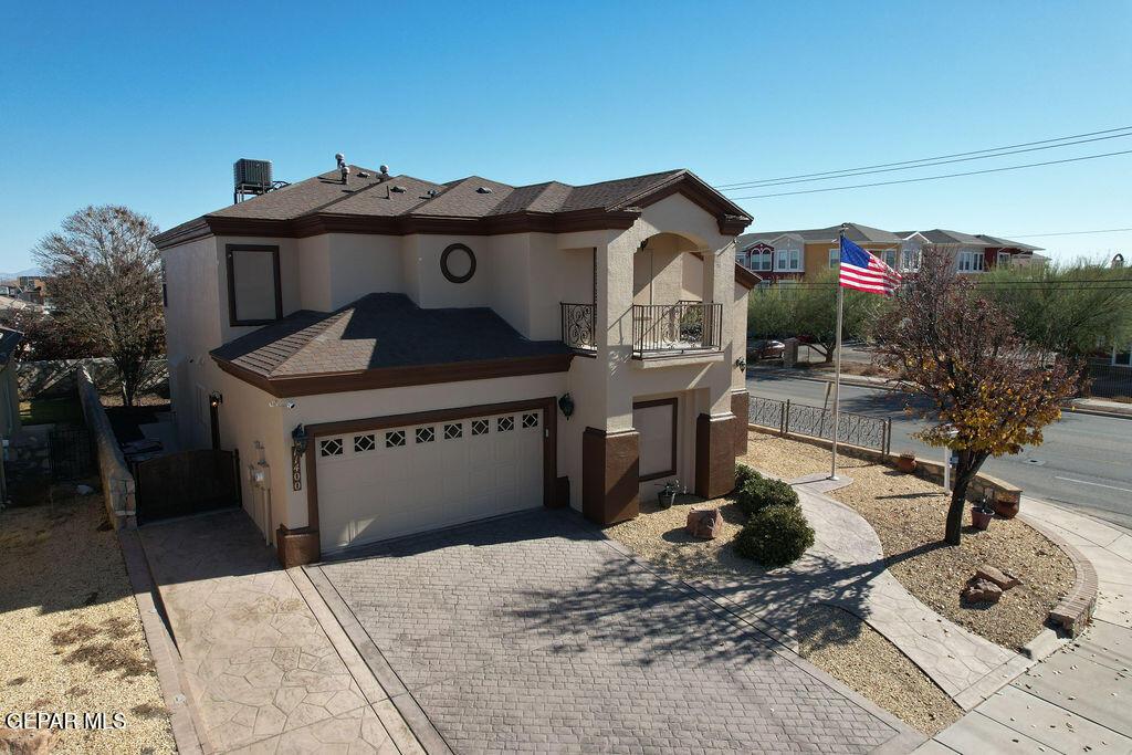 11400 Victor Flores Pl, El Paso, TX 79934 - view of front of property featuring a garage and a balcony