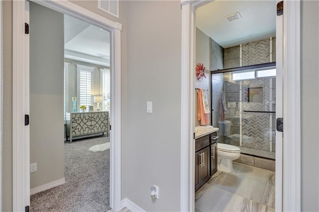 1701 Bull Ring St, El Paso, TX 79928 - bathroom with plenty of natural light, vanity, a shower with door, and toilet