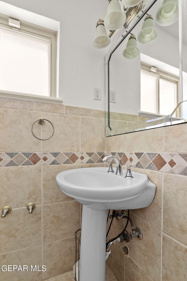 bathroom with tile walls