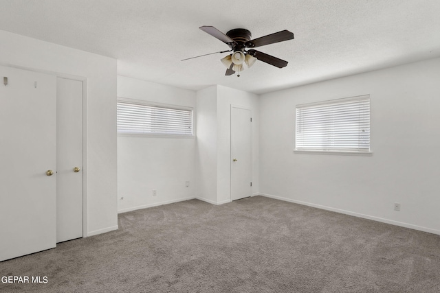 unfurnished bedroom with light carpet and ceiling fan