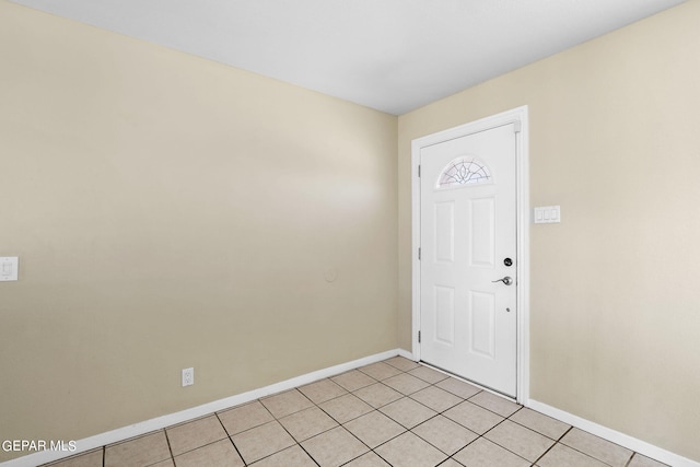 foyer entrance with light tile patterned floors